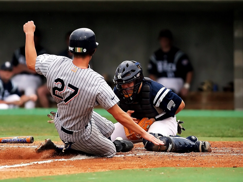 Baseball player sliding home base